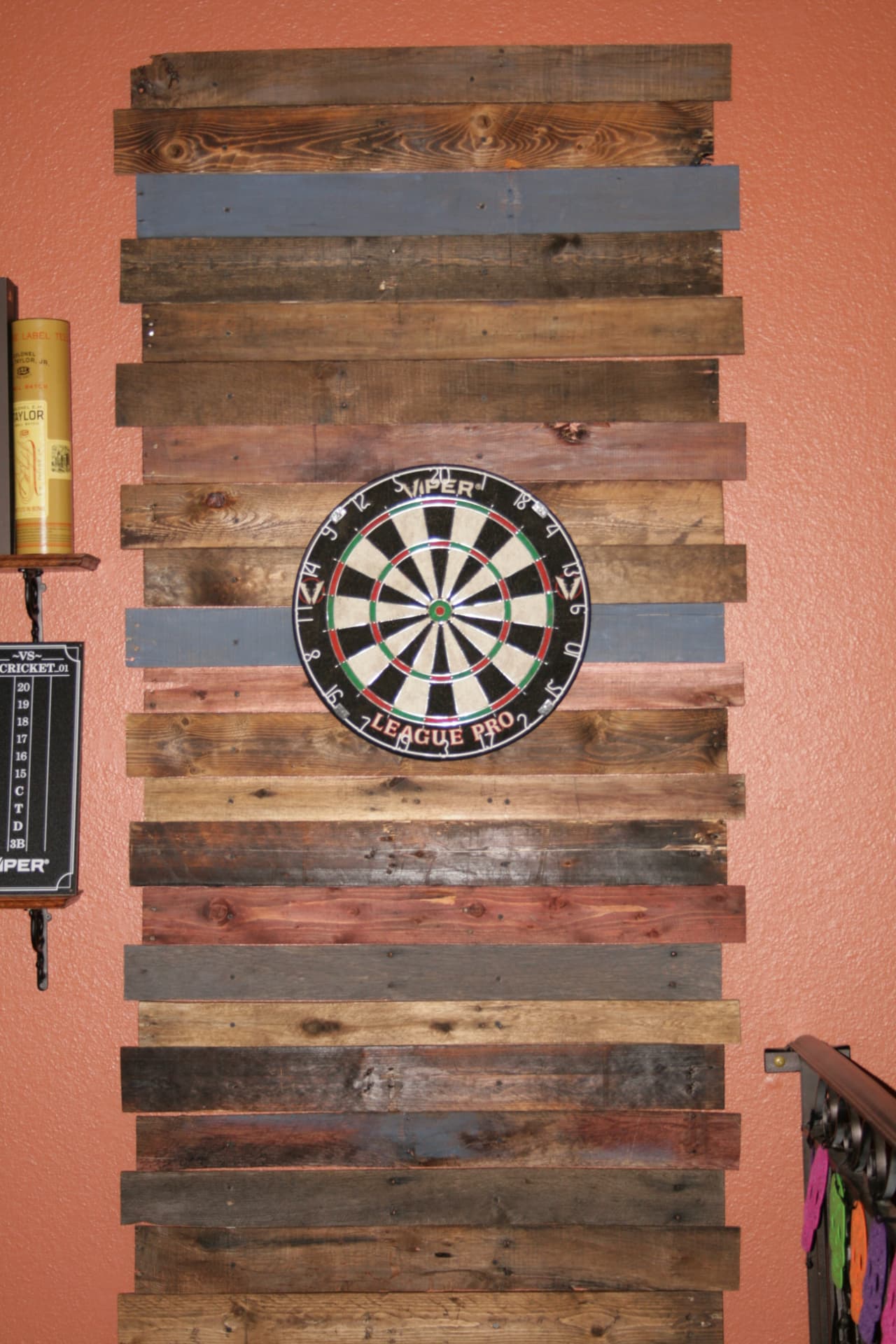 Dartboard on a reclaimed wood wall at RNA Tavern